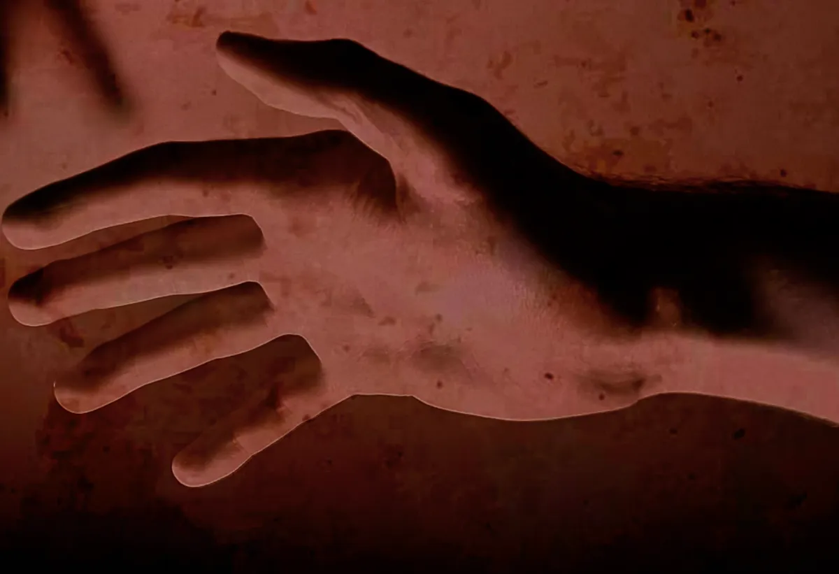 SILENTIUM cover art: a pale hand reaching out while shadowed hands close in from above.